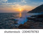 Small photo of Beautiful seascape with group of rocks ,wave ,mountain at sunset time in the summer ,Khao Lem Ya , famous attractions landmark , Rayong Province ,Thailand.Long time exposure .