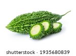Closeup fresh bitter gourd ( bitter cucumber, Momordica Charantia or bitter melon ) with cut slice isolated on white background. 