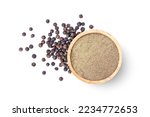 Ground pepper in wooden bowl and black peppercorns isolated on white background. Top view, flat lay.