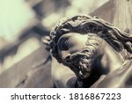 Small photo of Crucifix. The face of Jesus Christ. (concept of self-sacrifice)