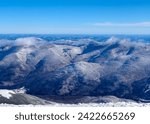 Small photo of The Wildcat and Carter Mountain Ranges in New Hampshire during the wintertime. These snowy 4000 footers are tall and cold on this clear NH wintertime.