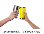 Small photo of Man and Boy hand holding silver and yellow thermos mug,Clinking mug,Isolated on white background.