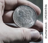 Silver Morgan Dollar In Hand