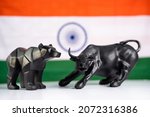 Small photo of stock market bull and bear with Indian flag as background - Concept of investment in Indian equity sensex share market