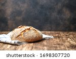 Homemade bread on a on rustic background copy space.