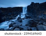 Tranquil view of Öxarárfoss waterfall in Thingvellir National Park in Iceland at dusk
