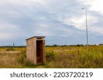 Wooden Outhouse In A Field ...