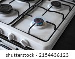 Gas stove burner with burning gas. Sale and purchase of gas fuel.