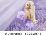 Pretty woman in summer day in lavender field. Lavender field concept.