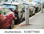 Charging modern electric cars (new energy vehicles, NEV) on the street station