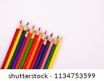 Small photo of Angled color map pencils multicolored on solid white background