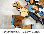 Europa on the political map. Wooden world map on the wall. Spain, France, Germany and other countries