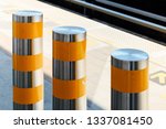 Stainless steel pole prevent people for security. Outdoor stainless steel bollard barriers with yellow line.