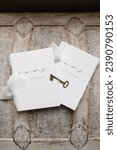 Small photo of Wedding detail photo of husband and wife vow books on a vintage wooden chest