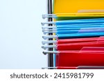 Small photo of The hook end of the file folder for placing files in the holder is in the form of a metal hook so that it doesn't come loose and is neatly arranged as seen from above on a white background