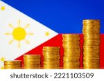 Small photo of Uprising graph of coin stacks against flag of Philippines. Concept of development of Philippines country, positive economy growth, financial success