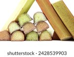 Small photo of Variety of rhubarb stalks of varying colors from pale green to deep red isolated on white background, health benefits of eating rhubarb