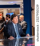 Small photo of Miami, Florida - November 17, 2022: Fox Nation Patriot Awards in Hard Rock Casino; Tucker Carlson the former most popular anchor on cable TV during show recording; Was fired by Fax News
