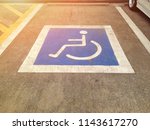 Parking for disabled guests at the parking lot. Symbol for disabled parking. Wheelchairs symbol.