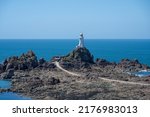 Small photo of La Corbiere lighthouse on the headland of St Brelade in the south-west of the British Crown Dependency of Jersey, Channel Islands, British Isles.