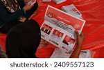 Small photo of Freelance daily workers fold ballot papers for the 2024 Election in a logistics storage warehouse, Pekalongan Indonesia January 5 2024