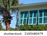 Small photo of Bright Blue Shutters on Beach House; Sullivan's Island, South Carolina.