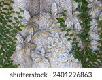 Carving of stone flowers on ivy ...