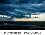 rain and large dark clouds over the sea
