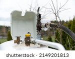 Small photo of Refueling the propane gas tank for home heating. Purchase and price of LPG. Tank for gas installation in a single-family house.