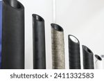 Small photo of A lot modern industrial plastic spiral hoses. Helical polymer wire reinforced pipes