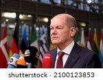 Small photo of Germany's Chancellor Olaf Scholz speaks to the press as he arrives to attend a European Union Summit with all 27 EU leaders at The European Council Building in Brussels, Belgium, 16 December 2021.