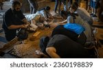 Small photo of Jerusalem, Israel - May 14 2023: Pilgrims at the Stone of Unction or Annointing in the Holy Sepulchre