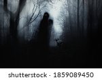 A Scary Hooded Figure With...