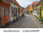 Colourful cobblestone streets of the main city of the island Aero in Aeroskobing, Denmark. Romantic fairytale, wedding and tourist destination. Travel concept.