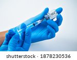 Small photo of Vaccination against the new Corona Virus Vacine-Covid19: A syringe being drawn up with Vacine-Covid 19.