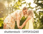 Small photo of Thank you for showing me the real meaning of love. Mother and daughter outdoor.