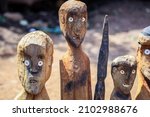 Small photo of Wooden memorial Totems (statues) with Eyes and Sticks in Traditional Tribal Konso Village, Ethiopia