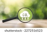 Small photo of CO2 emission concept. Green industries business concept. Net zero emissions. Magnifying glass with Co2 symbol. Concepts Net Zero Emissions Goals A climate-neutral. Renewable energy. ecology solutions.