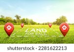 Small photo of Land plot management - real estate concept with a vacant land on a green field available for building construction and housing subdivision in a residential area for sale, rent, buy or investment.