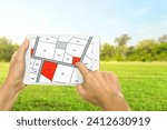 Small photo of Man holding a tablet looking at lots of lands. Land plot management - real estate concept with vacant land for building construction and housing subdivision for sale, rent, buy, or investment.
