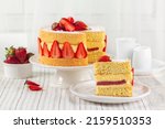 Small photo of Piece of French Fraisier Cake. Fruitcake made with two layer of Genoise Sponge, Diplomat Cream, strawberry jelly layer and Fresh Strawberries.