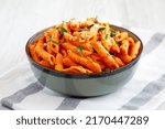 Small photo of Homemade Penne Alla Vodka from Leftover Sauce with Cheese and Parsley, low angle view.
