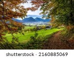 A village in a mountain valley in autumn. Mountain valley village in autumn. Autumn mountain valley village. Valley village in autumn mountains
