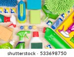 Cleaning supplies on wooden background, top view