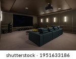 Luxurious theater room with large screen and lighting