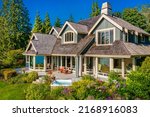 Stately waterfront home in pacific northwest with ocean views expansive decks hot tub front porch and long paved driveway