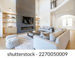 Small photo of Elegant and spacious open concept interior rooms new construction with concrete floors designer decor wood beams on ceiling classic style