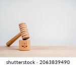 Small photo of A wooden judge gavel with words, ethics, respect, honesty, and integrity with the soundboard with scales icon, toys on wooden table, white background with copy space, minimal style. Justice concept.