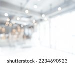 Abstract blurred modern workspace background, white indoor interior office or hospital with window and the light with copy space. Blurry backgrounds for advertising and business presentation.