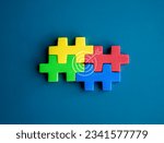 Four jigsaw puzzle blocks different colors are put together perfect with goal target icon on blue background, minimalist. Business partnership, teamwork, difference, unity and collaboration concepts.